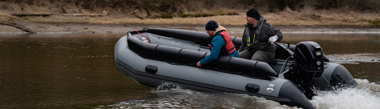 A jet tunnel inflatable boat in a shallow river with two people